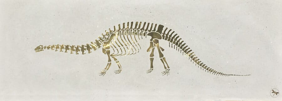 A Brad Teasdale art piece depicting a brontosaurus made of brass inlaid in concrete.