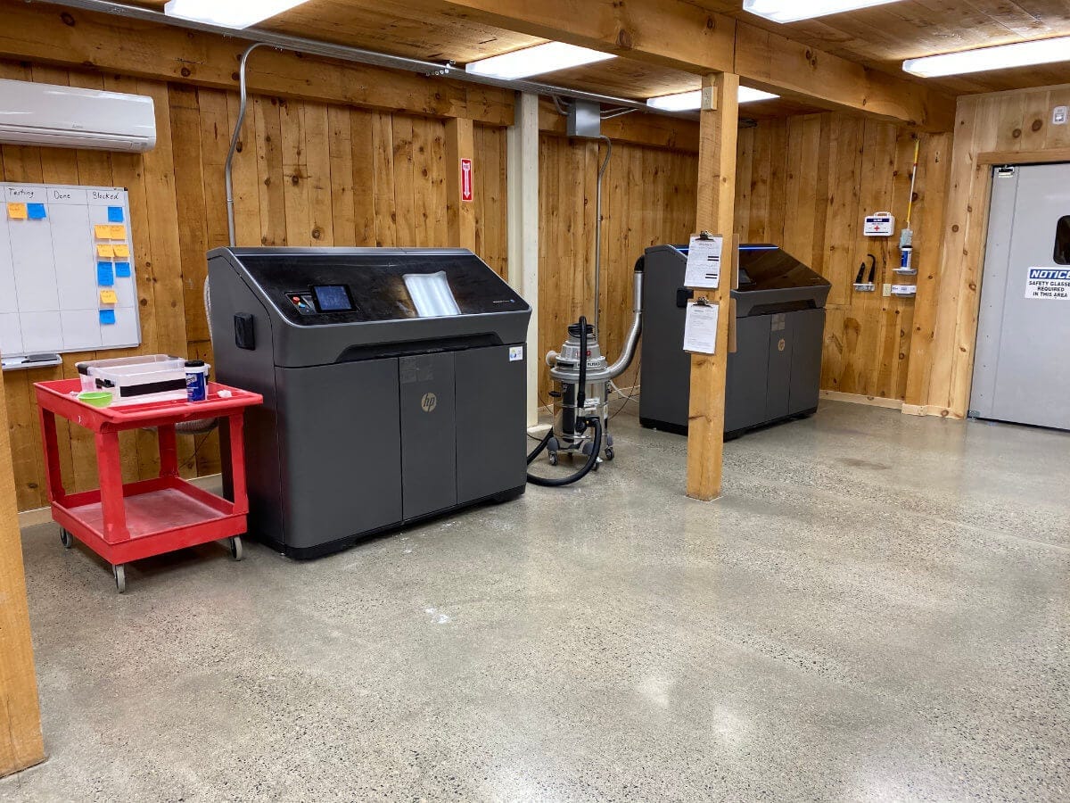 Several industrial-grade 3D printers at the Unlimited Tomorrow offices in Rhinebeck NY