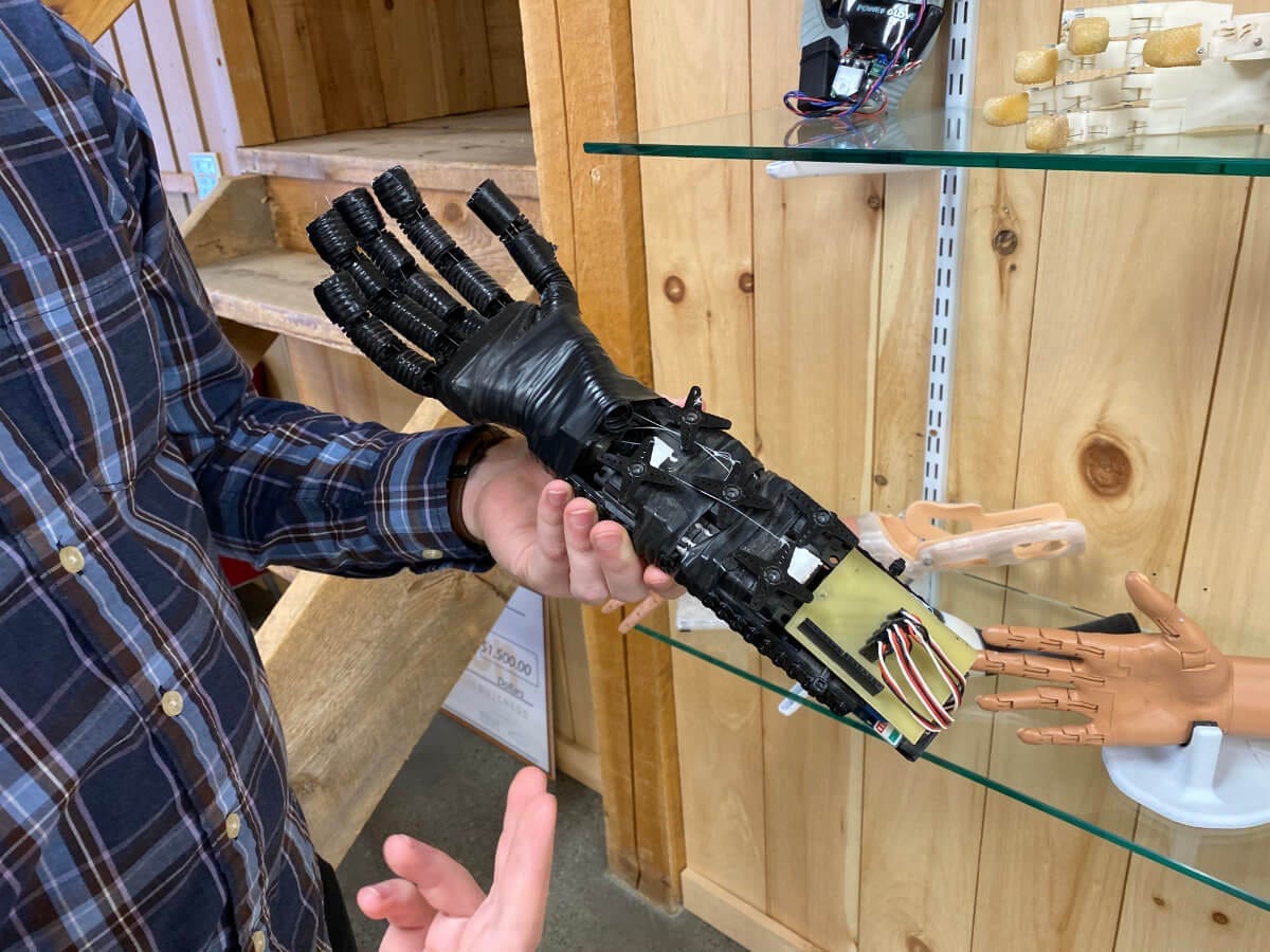 Easton LaChappelle holding an early prototype of the Unlimited Tomorrow prosthetic hand