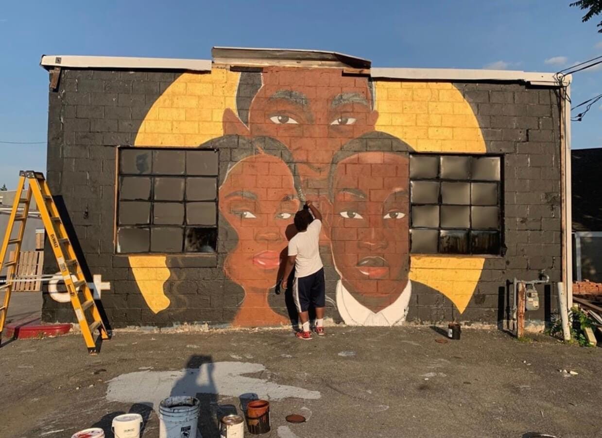 Jalani Lion painting the Black Lives Matter mural in Kingston NY