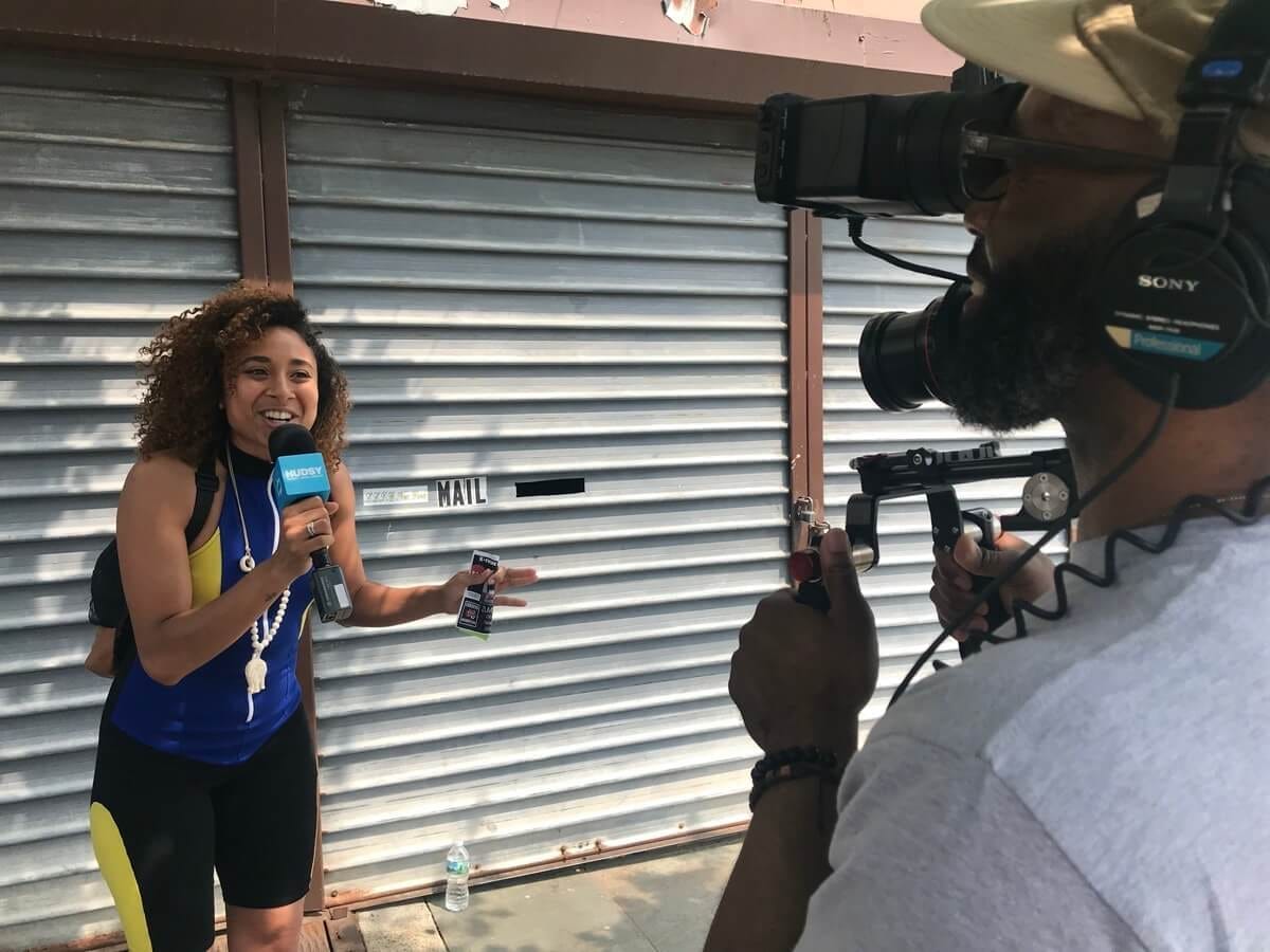 A HUDSY correspondant on the microphone at an event