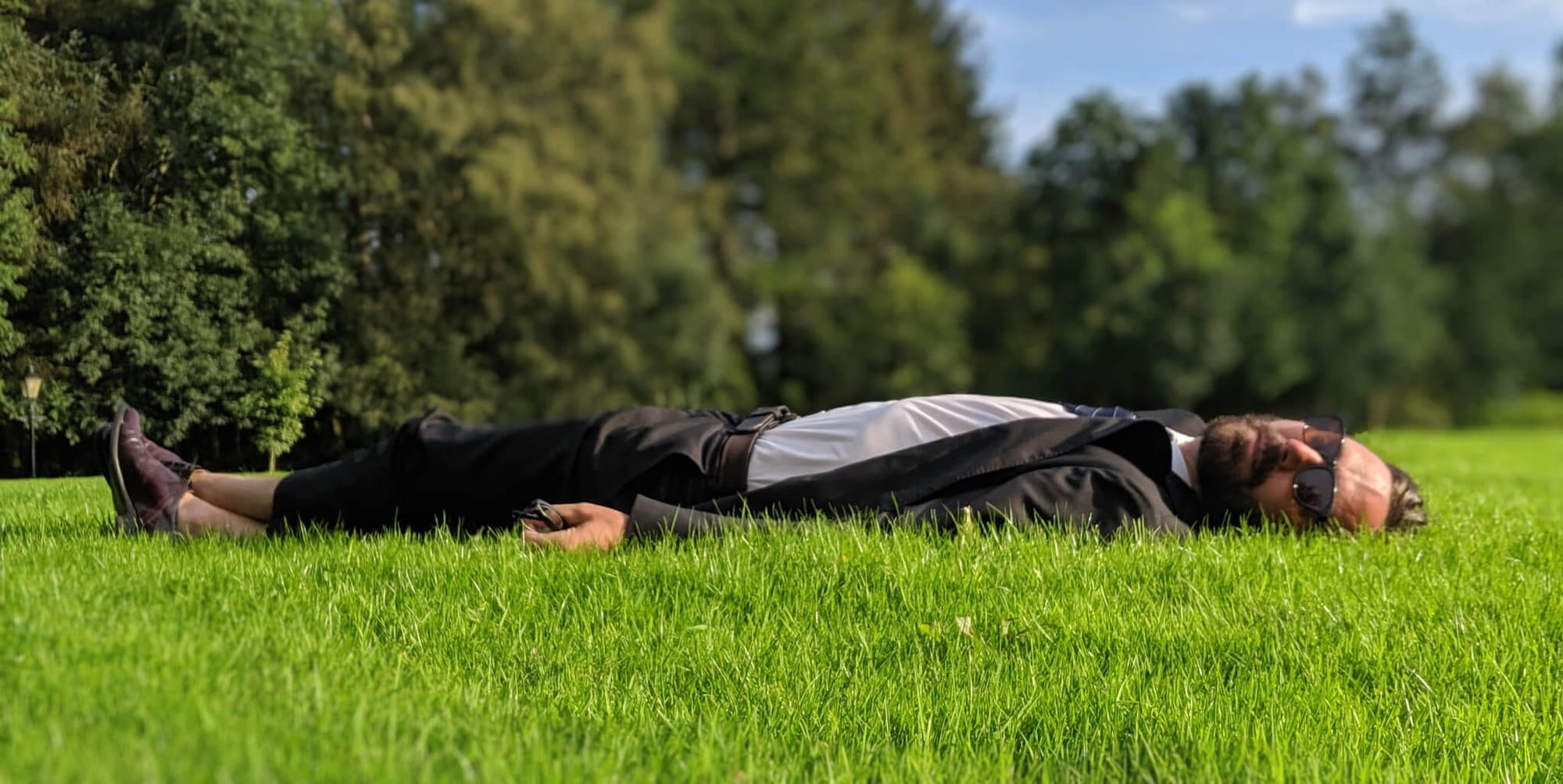 Hudson Valley-based musician Matt Pond laying in the grass