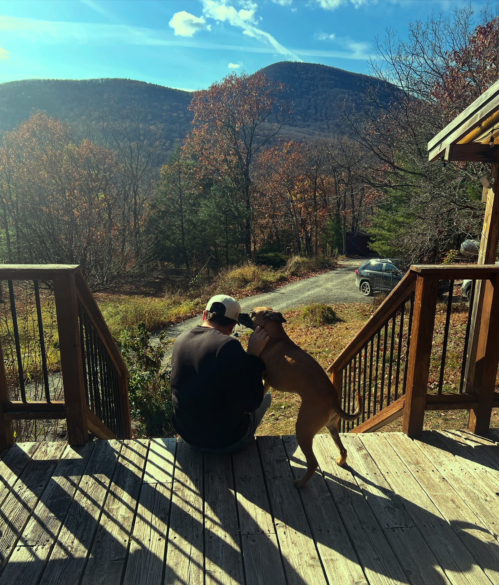 Musician Michael Marcagi with Sputnik, producer David Baron's dog, at his Hudson Valley studio