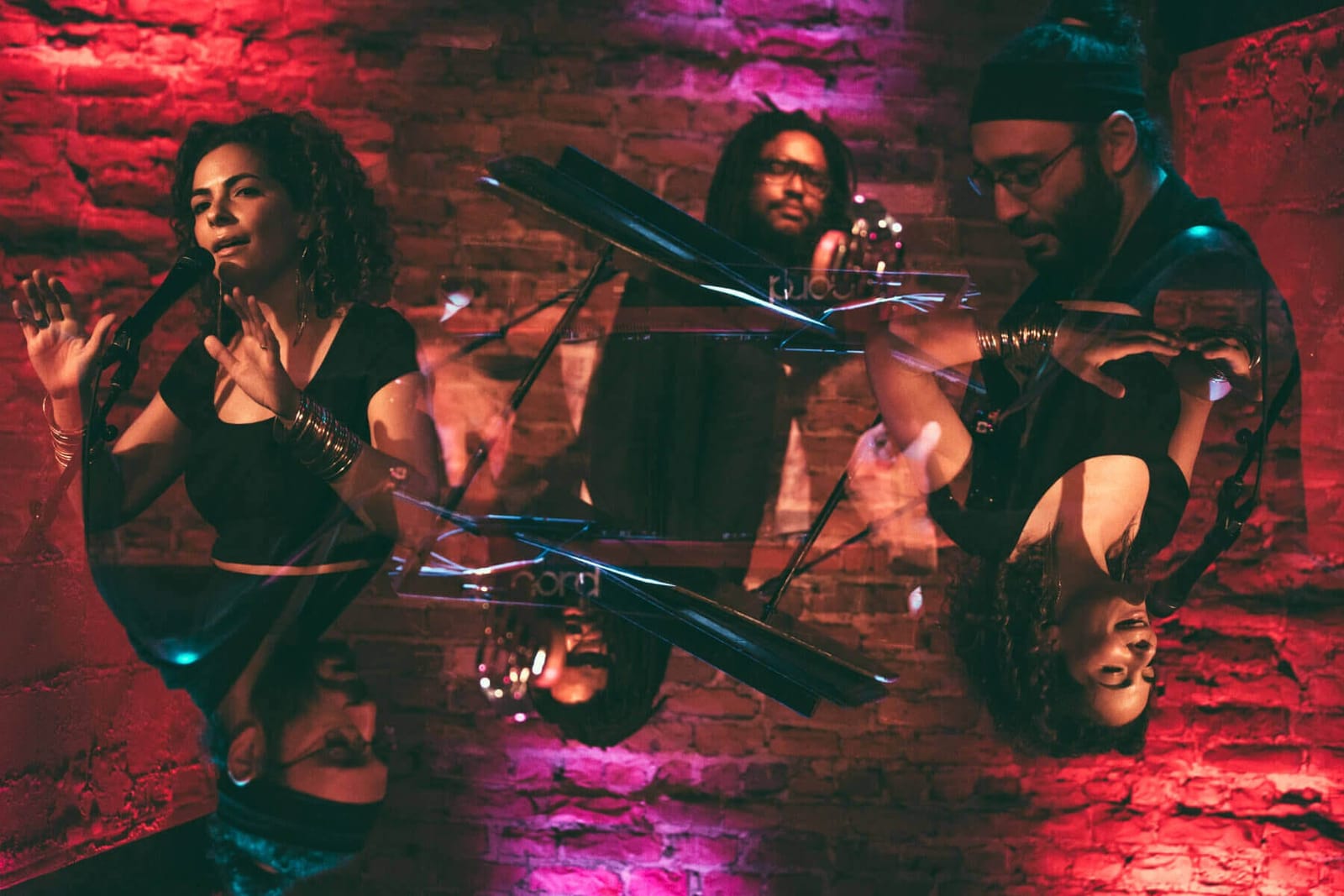 Hudson Valley musician Natalie Forteza performing at Rockwood Music Hall with bandmates Akie Bermiss and Anthony Candullo