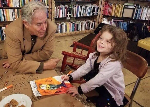Hudson Valley author Neil Cohen with a young fan at Rough Draft in Kingston
