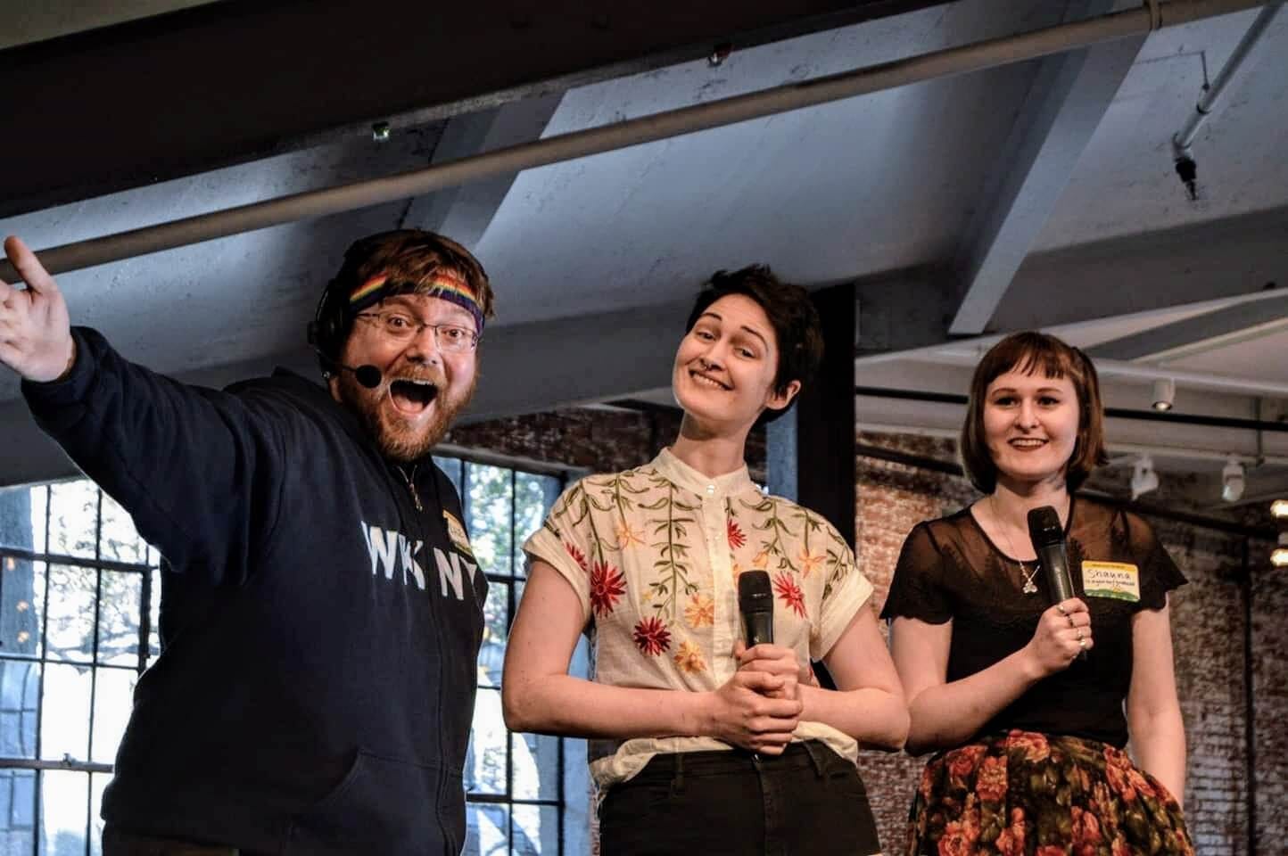 Shauna Keating emceeing an HV Tech Meetup event in Kingston, alongside co-organizers Kale Kaposhilin and Erin Barth-Dwyer.