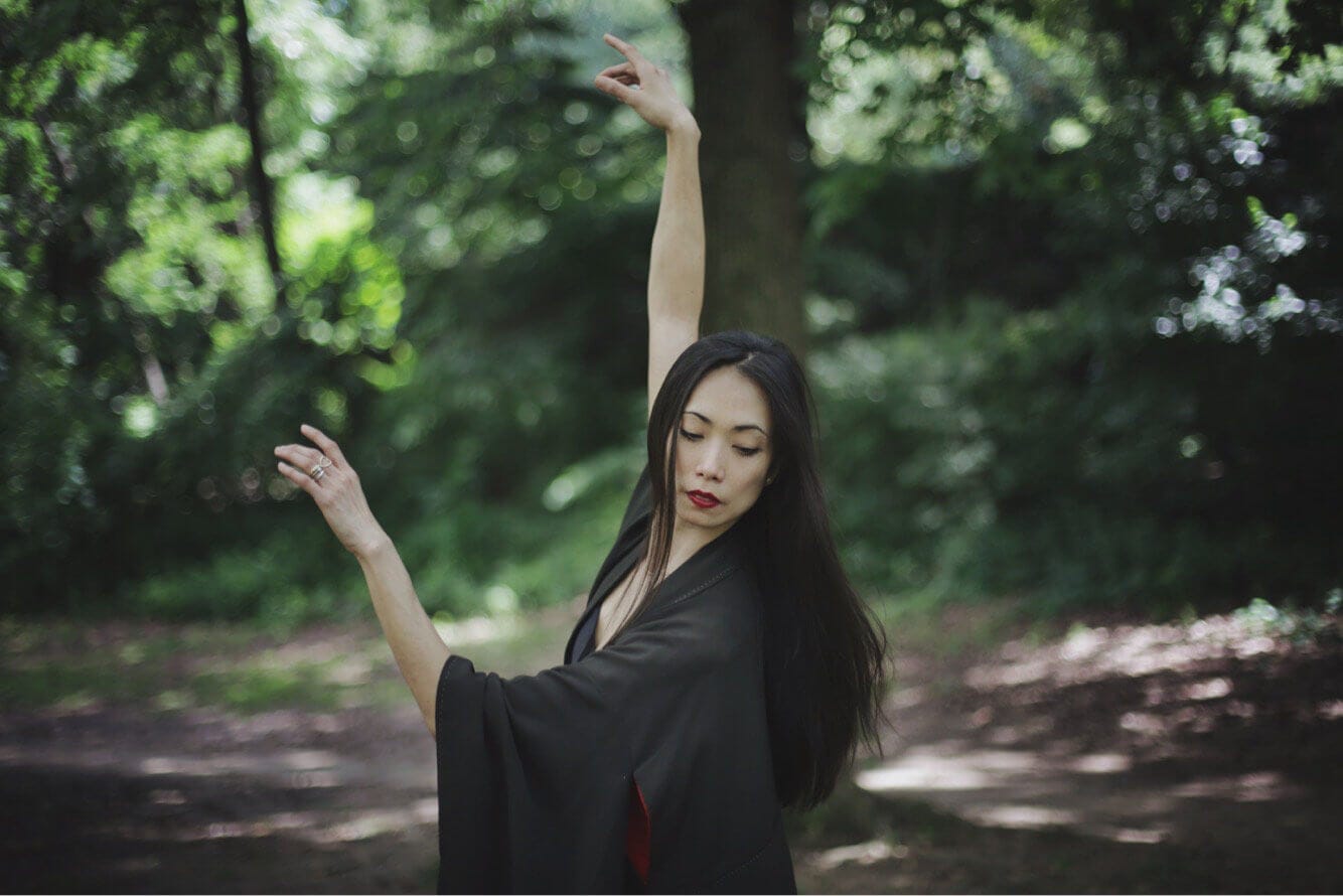 Stella Abrera dancing in the woods